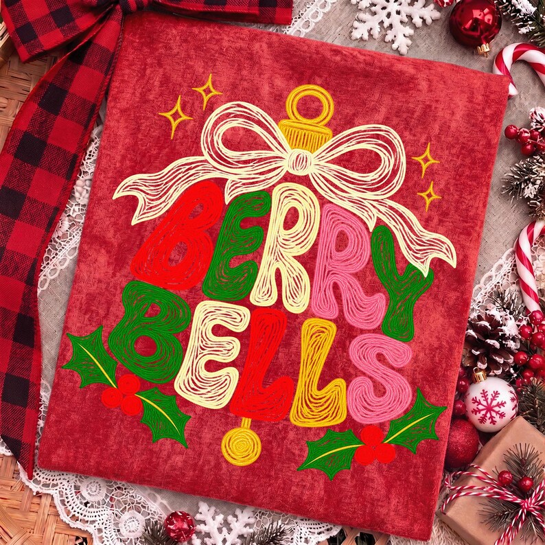 May include: A red fabric square featuring a graphic of a bell formed by the text BERRY BELLS in red, green, yellow, and pink, topped with a white line-art bow, and accented with green holly leaves and red berries on a textured red background.