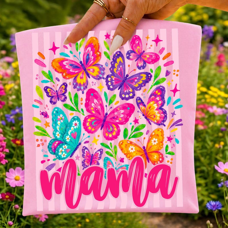 May include: A rectangular pink fabric pouch featuring a vertical striped pattern and a colorful graphic print of various butterflies in shades of orange, purple, blue, and pink, with the word mama written in a bold pink script font at the bottom.