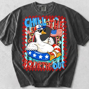 May include: Dark gray t-shirt featuring a cartoon goose wearing sunglasses and a patriotic hat, floating in a red, white, and blue inner tube. The shirt has the text "CHILL THE FOURTH OUT" in red and blue.