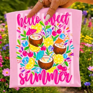 May include: A light pink fabric pouch featuring a vertical white striped pattern and the text "hello sweet summer" in bright pink script. The design includes illustrations of coconut halves, lemon slices, cherries, blue ice cubes, and colorful cocktail umbrellas.