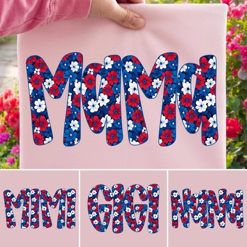 May include: A light pink fabric with the word "MAMA" in large, bold letters. The letters are filled with a floral pattern in red, white, and blue, resembling a patriotic design. Additional text below reads "MIMI", "GIGI", and "NANA".
