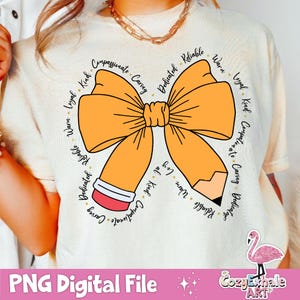 May include: A white t-shirt featuring a yellow bow and a pencil design. The bow and pencil are encircled by words describing positive character traits, such as "compassionate", "caring", "dedicated", "reliable", "warm", "loyal", "kind", and "helpful".