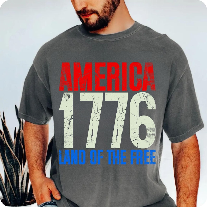 A close-up of a 4th of July sublimation design featuring bold red, white, and blue graphics with beach and pool elements, perfect for summer apparel.