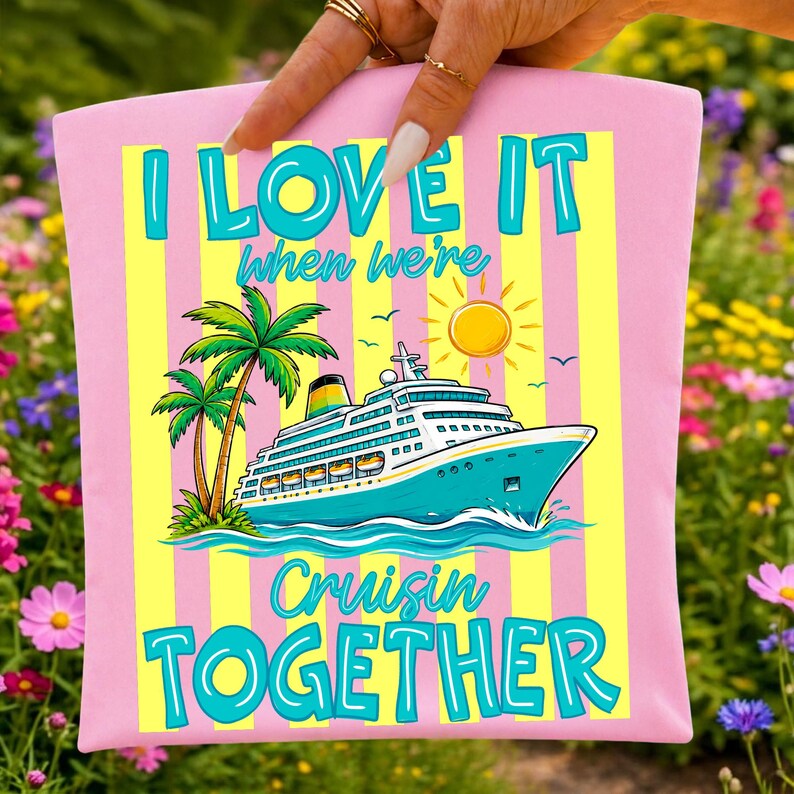 May include: Pink t-shirt with the text "I LOVE IT when we're Cruisin TOGETHER". The graphic features a cruise ship, palm trees, a sun, and birds. The text and graphics are in shades of blue, yellow, and green.