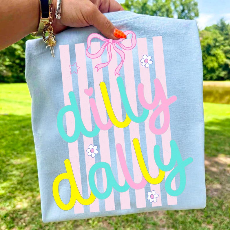 Mockup of a trendy t-shirt featuring the Dilly Dally colorful stripe graphic