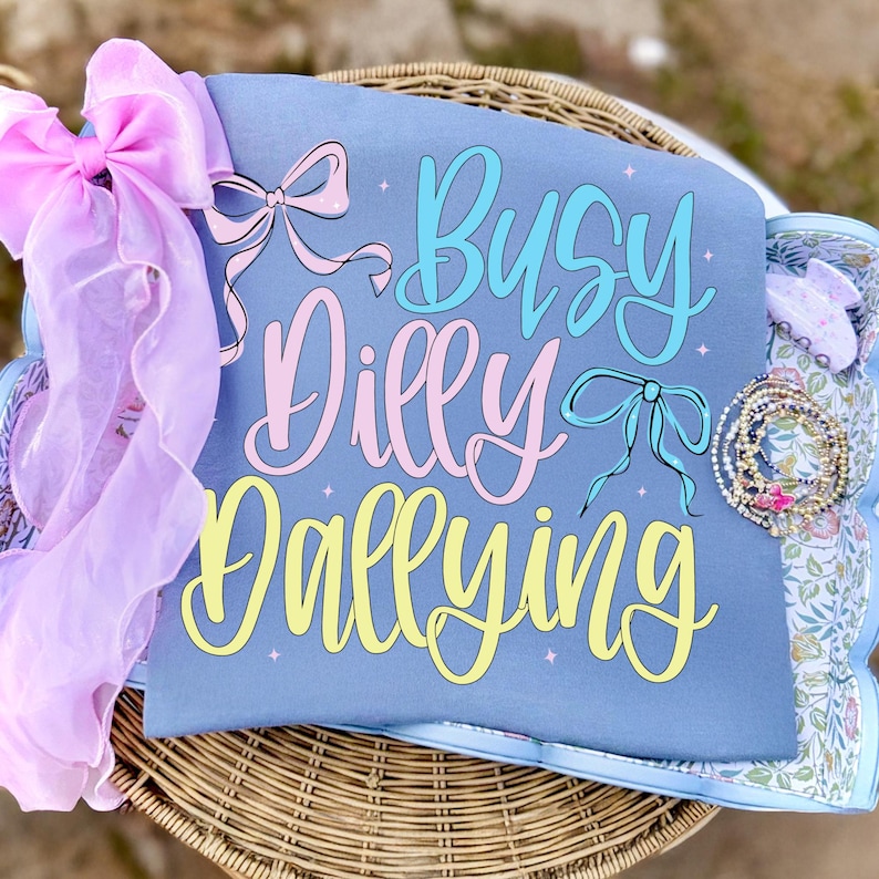 Busy Dilly Dallying Coquette Bow Sublimation Design on Summer Shirt