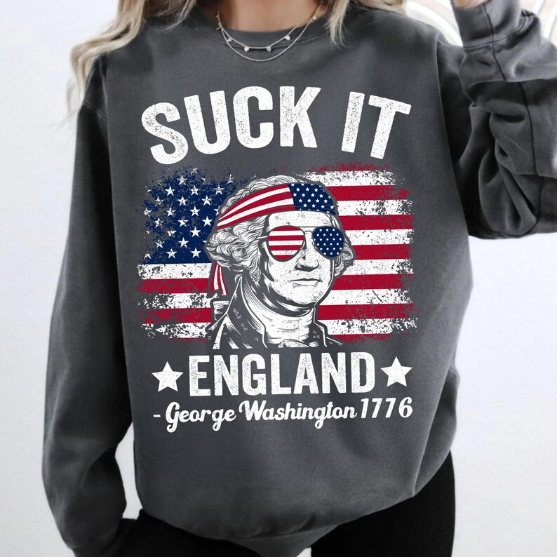 Mockup of a t-shirt featuring the 'Suck It England' George Washington design, demonstrating apparel application.