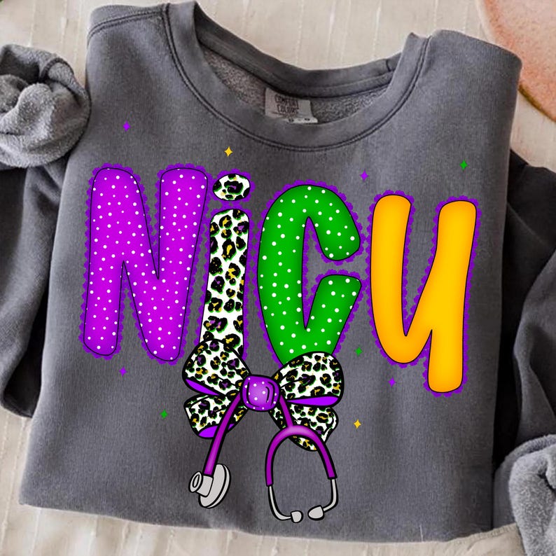May include: Gray sweatshirt with the word "NICU" in large, colorful letters. The letters are purple with white polka dots, green with white polka dots, and yellow. A bow and stethoscope are below the letters.