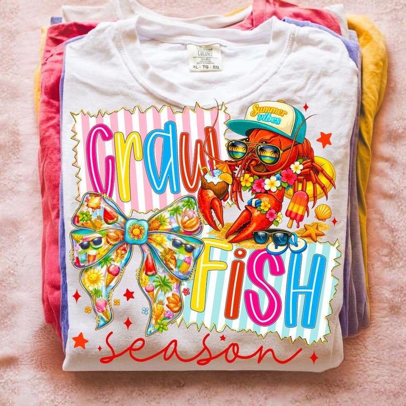 May include: White t-shirt with a colourful graphic design featuring a lobster wearing sunglasses and a hat, with the words "Crawfish Season" in bright colours. A bow with sunglasses is also featured.