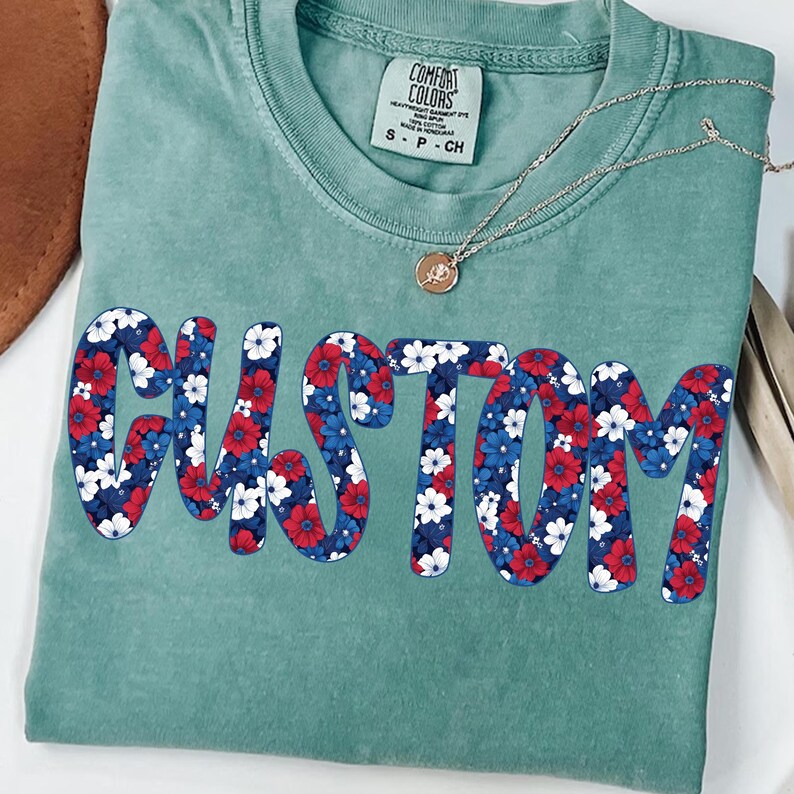 Mockup of a t-shirt featuring the Ditsy Floral Independence Day design