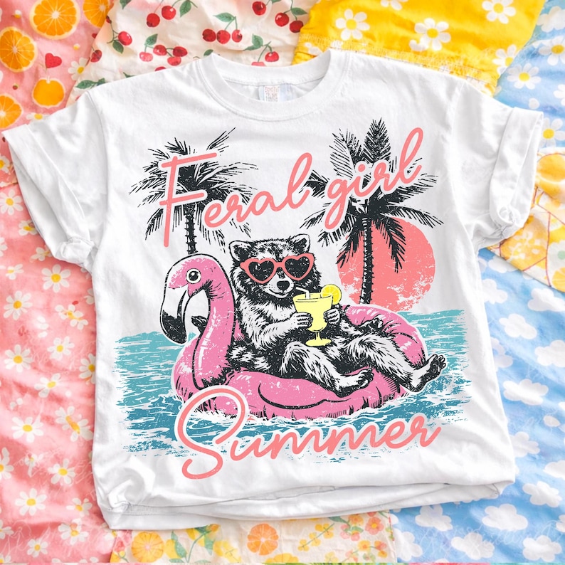 Close-up of the Feral Girl Summer Raccoon PNG design on a white t-shirt mock-up, showcasing its retro distressed style and vibrant colors