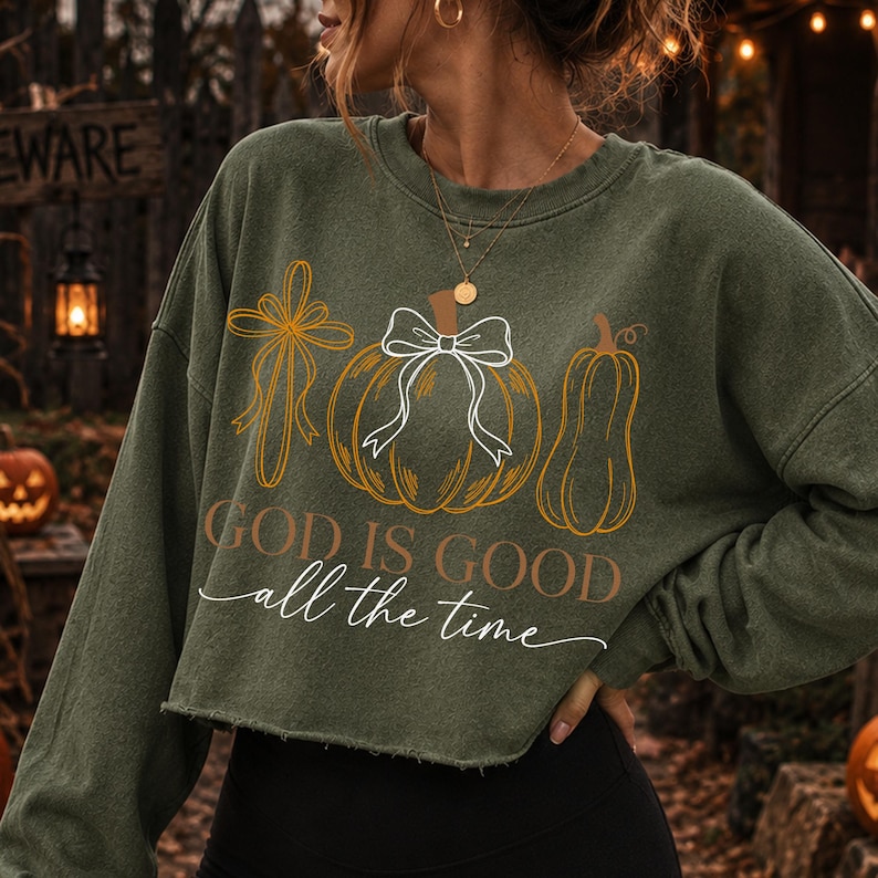 Mockup of 'God Is Good All the Time' Christian fall pumpkin design on a cozy t-shirt.