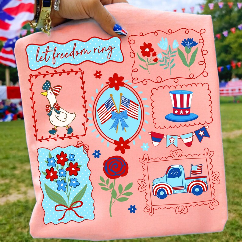 May include: A peach-colored t-shirt featuring patriotic illustrations. Designs include a goose, flowers, flags, and a truck, all framed with red borders. The text "let freedom ring" is also displayed.