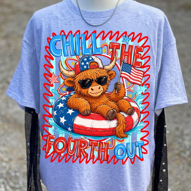 May include: Light blue t-shirt featuring a cartoon Highland cow wearing sunglasses and a patriotic hat, floating in a red, white, and blue inner tube. The shirt has the text "Chill the Fourth Out" in a wavy font.