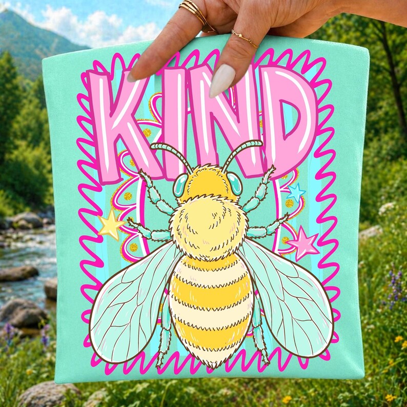 Mockup of a t-shirt displaying the 'Be Kind Bee' preppy summer sublimation design for crafters.