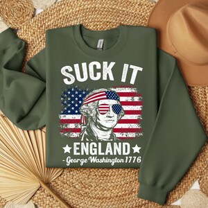 Celebrate Independence Day with this hilarious Suck It England PNG! Featuring George Washington and a bold patriotic message, this design is perfect for 4th of July shirts, party gear, or sublimation projects. Whether it’s for a funny, tongue-in-cheek celebration or a bold statement of American pride, this high-quality PNG is ready for instant download. Create playful and patriotic designs that make your 4th of July unforgettable