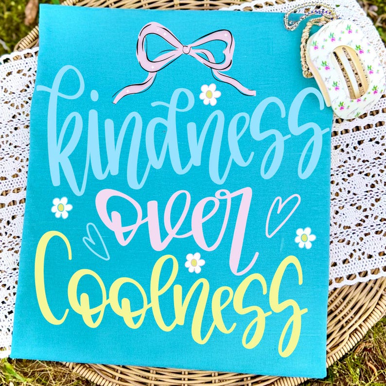 Close-up of Kindness Over Coolness PNG with Coquette Bow and Doodles