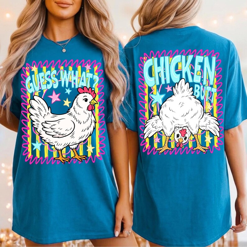 May include: Teal t-shirt with a cartoon chicken graphic. The front of the shirt says "GUESS WHAT?" with a drawing of a chicken. The back of the shirt says "CHICKEN BUTT" with a drawing of a chicken's rear end.