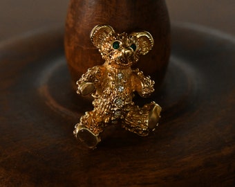 vintage gold tone teddy bear pin/ brooch - green rhinestone eyes ~ clear rhinestone detail - 1980's