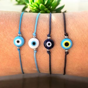 Evil Eye Bracelet: Glass Bead, Stainless Steel, Adjustable Cord