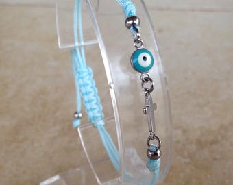 Bracelet femme oeil turquoise et croix en acier