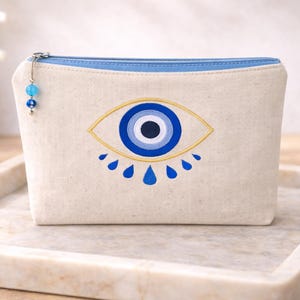 Ręcznie robiony woreczek Evil Eye: haftowany płócienny woreczek grecki