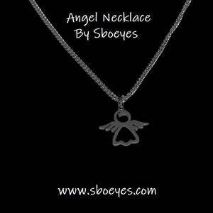 May include: A silver chain necklace with an angel pendant. The pendant is a cutout of an angel with wings. The necklace is on a black background. The text "Angel Necklace By Sboeyes" is above the necklace and the text "www.sboeyes.com" is below the necklace.