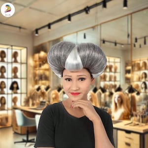 May include: A gray and white wig with a unique, voluminous style. The wig features a central white section and is styled in a rounded shape. The person in the image is wearing a black shirt and red lipstick. The background is a wig shop.