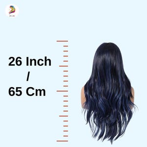 May include: A long, wavy wig with dark blue and navy highlights. The wig is 26 inches long. The text on the left side of the image reads "26 Inch / 65 Cm". The wig is displayed against a light blue background.