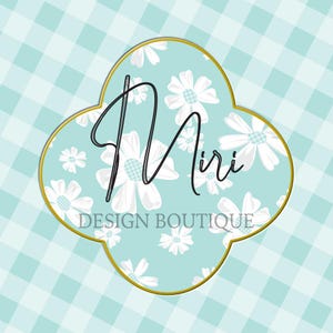 May include: A logo for Miri Design Boutique. The logo is a four-leaf clover shape with a gold border. The interior has a light blue background with white daisy flowers. The name "Miri" is written in a cursive font, and "DESIGN BOUTIQUE" is written below.