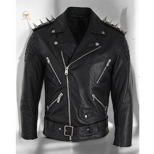 May include: Black leather motorcycle jacket with silver studs on the shoulders and a zipper closure. The jacket has a belt at the waist and multiple pockets.