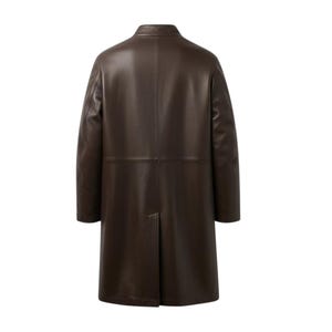 May include: A dark brown leather coat with a classic design. The coat features a notched collar, long sleeves, and a knee-length hem. The back of the coat has a center vent for ease of movement. The coat is made of a smooth, supple leather.