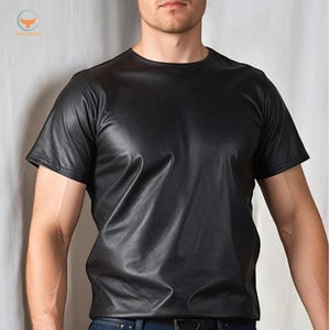May include: A black leather short-sleeved t-shirt.