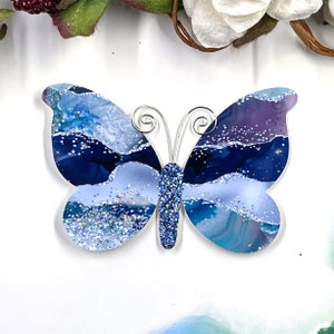 Blue, purple silver agate patterned paper butterfly embellishment.