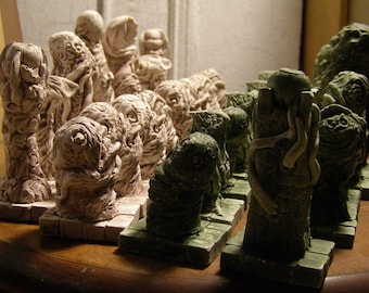 a Weird Horror Chess-Set in the Hues of Moss and Aged Bone