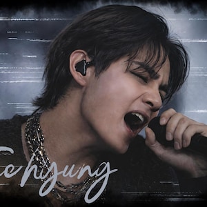 May include: A portrait of a person singing into a black microphone while wearing a black in-ear monitor and a layered silver chain necklace. The name Tae hyung is written in white cursive script across the bottom left of the dark, textured image.