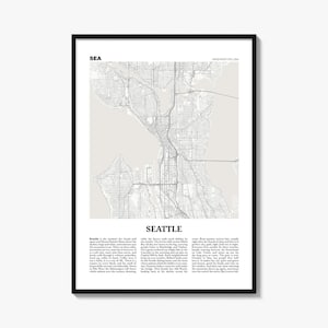 May include: A framed wall art print featuring a detailed light gray map of Seattle, Washington, USA. The design includes the city name in bold black text, the location label, and a descriptive paragraph of text about the city printed below the map.