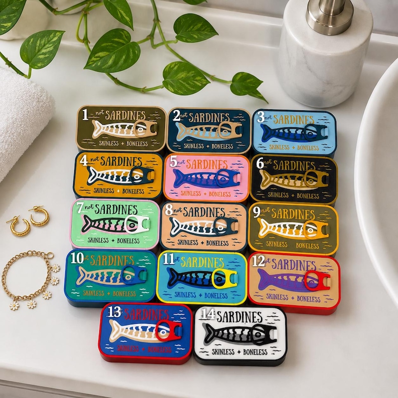 May include: Fourteen rectangular tins labeled 1 through 14 with the text "not SARDINES" and "SKINLESS + BONELESS". Each tin features a stylized fish graphic with a pull-tab ring. The tins are arranged in a grid with various colorful backgrounds.