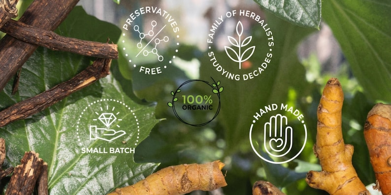 May include: Close-up of natural ingredients with text overlays. The image features turmeric roots, dark brown sticks, and green leaves. Text includes "Preservatives Free", "Family of Herbalists Studying Decades", "100% Organic", "Hand Made", and "Small Batch".