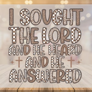 May include: A decorative sign with the text "I SOUGHT THE LORD AND HE HEARD AND HE ANSWERED." The text is in brown, with checkerboard and leopard print patterns. Two crosses and starbursts are also present.