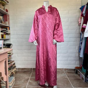 May include: A set of three ceramic mugs with a speckled, matte finish. Each mug features a different color: light blue, cream, and gray. The mugs have a simple, modern design with a rounded shape and a comfortable handle.