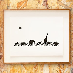 May include: Framed art print showing black silhouettes of animals like a giraffe and elephant on a white background, with a black sun. The print is in a white mount and a natural wood frame. The artwork depicts a variety of wildlife.
