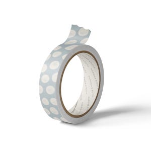 May include: A roll of decorative washi tape with a light blue background and white polka dots. The tape is partially unrolled, revealing the inner cardboard core. The brand name "RAMONA & RUTH" is printed on the tape's edge.