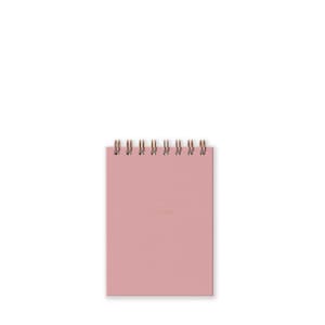 May include: A pink spiral bound notebook with the words "To Note" in gold lettering on the front cover.