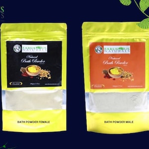 Puede incluir: Dos bolsas amarillas con etiquetas blancas que contienen polvo de baño. Las etiquetas tienen el texto "Fabulous Naturals" y "Natural Bath Powder". Las bolsas están etiquetadas como "Bath Powder Female" y "Bath Powder Male".