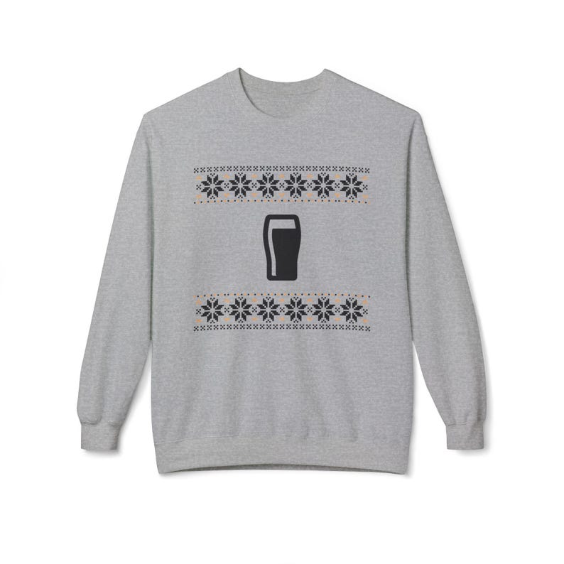 Cozy holiday sweatshirt featuring a simple black pint glass design surrounded by festive knit-style snowflakes. Perfect for beer lovers, stout fans, and anyone who enjoys a classic winter look. Unisex white or gray sweatshirt with a soft, brushed interior and relaxed fit — ideal for Christmas parties, pub nights, or lounging by the fire. Eco-friendly materials and durable design for lasting comfort and holiday cheer. Keywords: guinness christmas sweater, beer lover gift, beer christmas gift