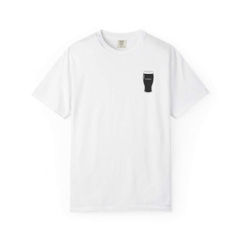 Unisex white t-shirt featuring a minimalist pint glass and the word “Sláinte,” meaning “health” in Irish, printed on the left chest. Perfect for St. Patrick’s Day, pub crawls, beer lovers, Guinness fans, and anyone who enjoys Irish culture. Made with soft garment-dyed cotton and a relaxed unisex fit, it’s a fun and comfortable drinking shirt for parties, casual outfits, and great as a gift for men and women who love beer and Ireland. Keywords: beer gift, beer shirt, guinness shirt, Irish pint