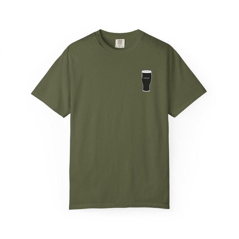 Unisex white t-shirt featuring a minimalist pint glass and the word “Sláinte,” meaning “health” in Irish, printed on the left chest. Perfect for St. Patrick’s Day, pub crawls, beer lovers, Guinness fans, and anyone who enjoys Irish culture. Made with soft garment-dyed cotton and a relaxed unisex fit, it’s a fun and comfortable drinking shirt for parties, casual outfits, and great as a gift for men and women who love beer and Ireland. Keywords: beer gift, beer shirt, guinness shirt, Irish pint