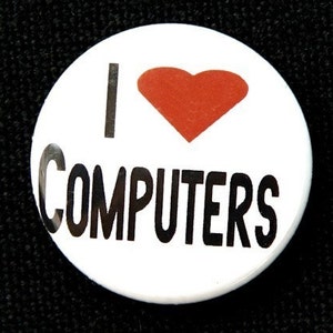 May include: White button with black text that reads "I love computers" and a red heart.
