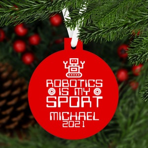 May include: Red round Christmas ornament with a white robot graphic and the text "Robotics is my sport Michael 2021".